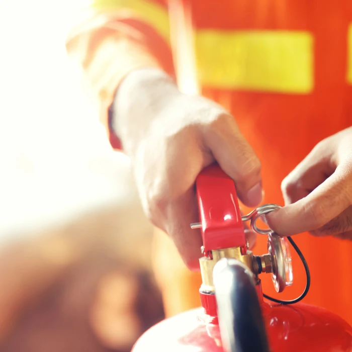 man-holding-a-fire-extinguisher